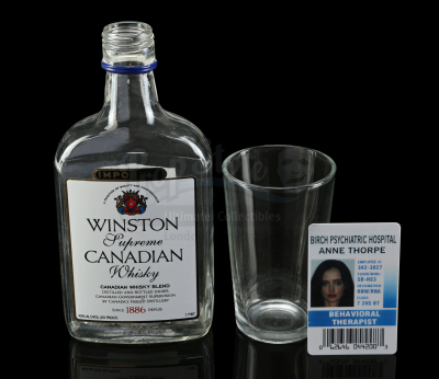 Lot # 194: Marvel's Jessica Jones (TV Series) - Jessica Jones' Whiskey Set and Hospital Badge