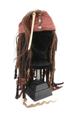 Lot #553 - PIRATES OF THE CARIBBEAN SERIES (2003-2017) - Captain Jack Sparrow's (Johnny Depp) and Angelica's (Penelope Cruz) Wig and Bandana