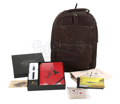 Lot #757 - STAR WARS: THE COMPLETE SAGA (1977-2019) - Leather Crew Backpack, Notebook, Pen and ILM Stormtrooper Pin Set