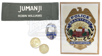 Lot #430 - JUMANJI (1995) - Van Pelt's (Jonathan Hyde) Gold Coins, Robin Wiliams Chairback, Police Badge and Police Car Decal