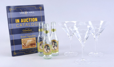 Lot # 95: Netflix's A Series of Unfortunate Events (TV Series) - Esme Squalor's Penthouse Martini Glasses and Parsley Soda Bottles with Auction Book